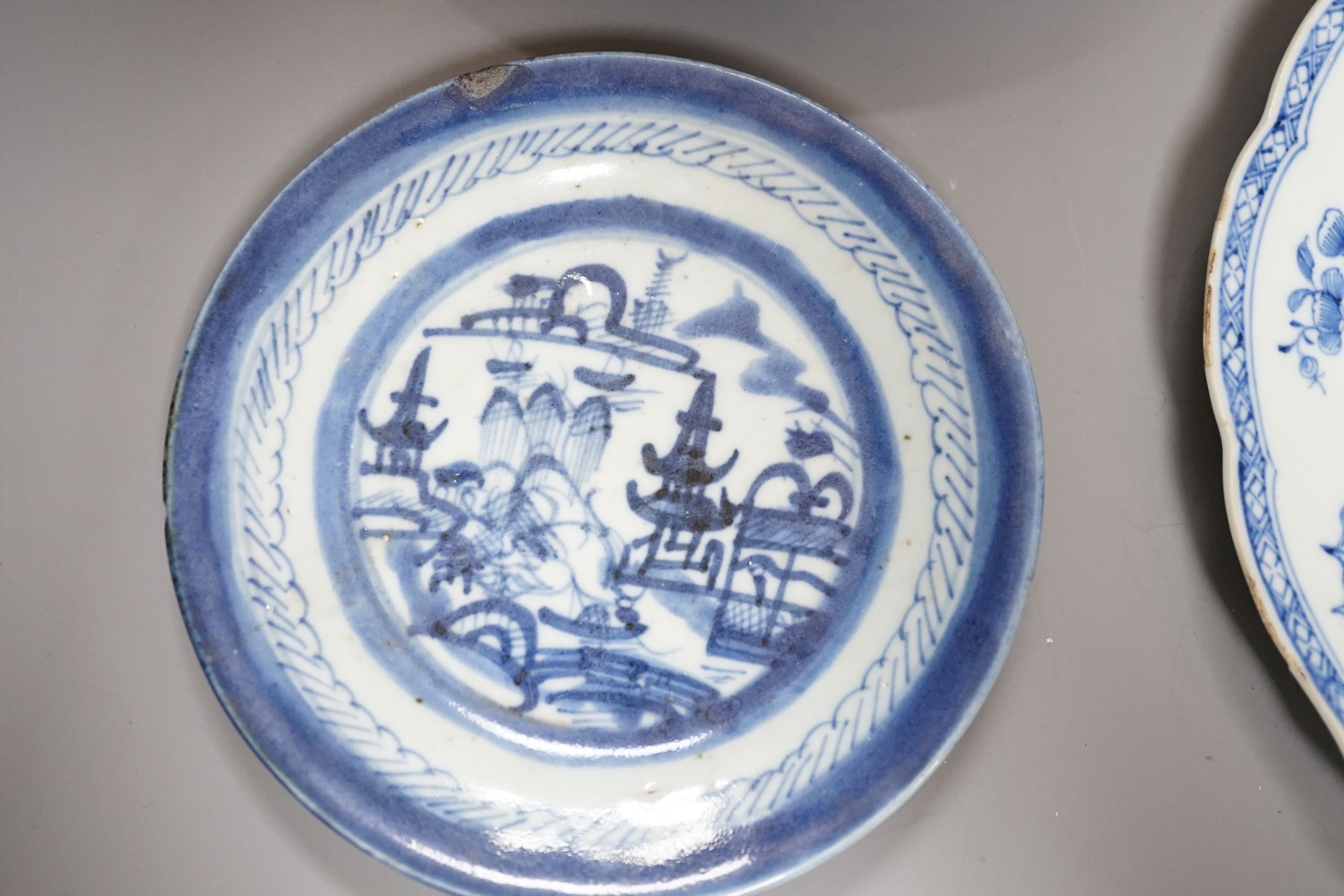 An 18th century Chinese export blue and white dish, 23cm, together with three other Chinese ceramic items